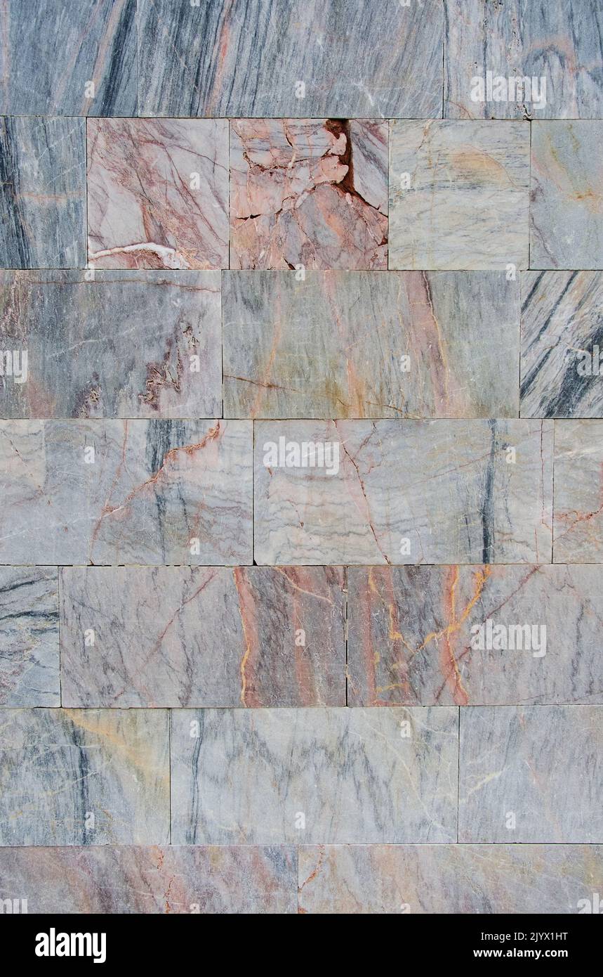 Background and texture wall finished with marble tiles Stock Photo