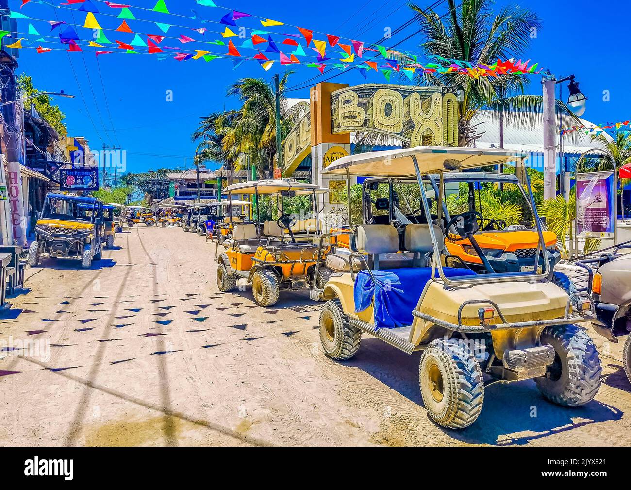 Holbox Mexico 16. May 2022 Golf cart buggy cars carts taxi on muddy