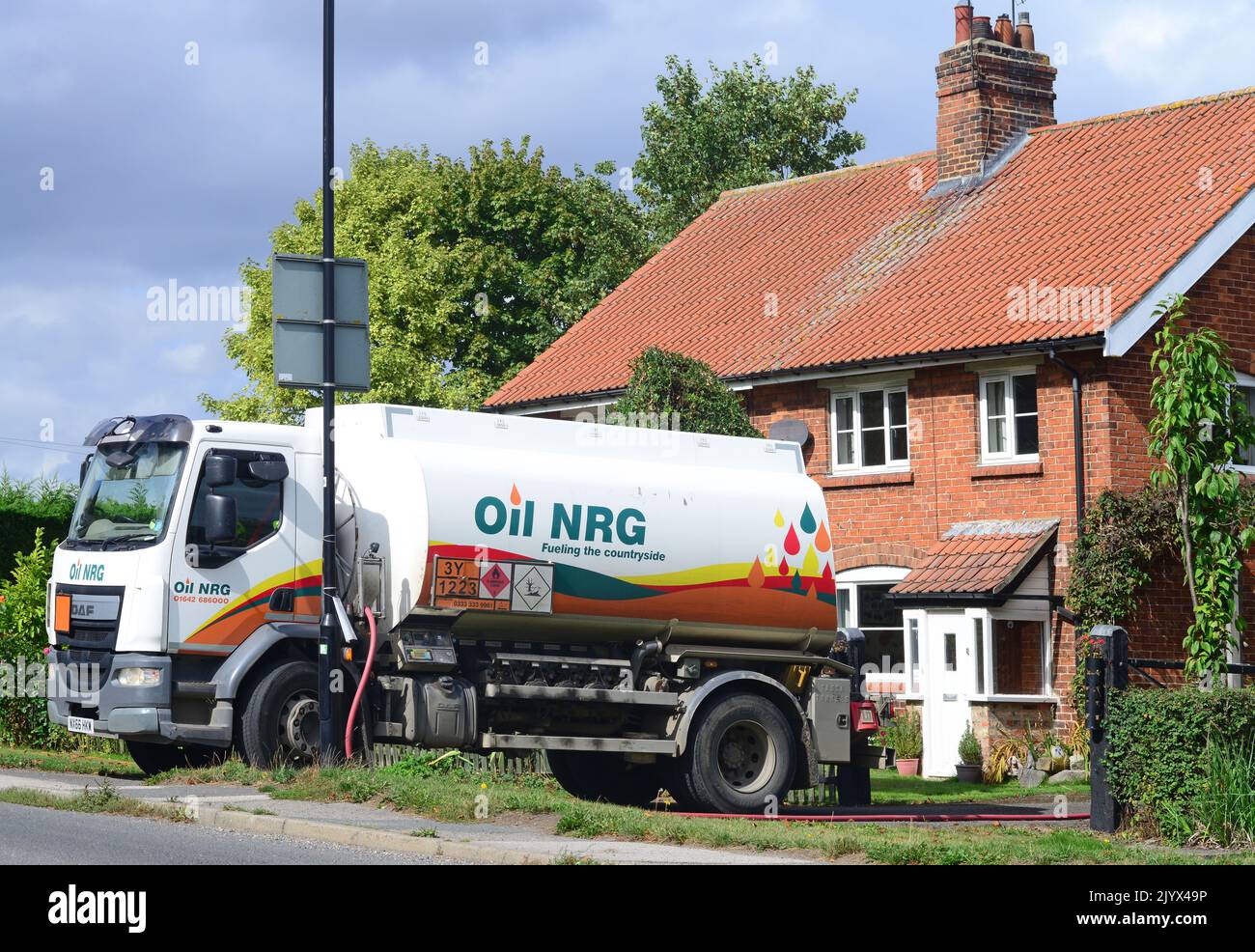 tanker lorry delivering fuel heating oil to residential customer united kingdom Stock Photo