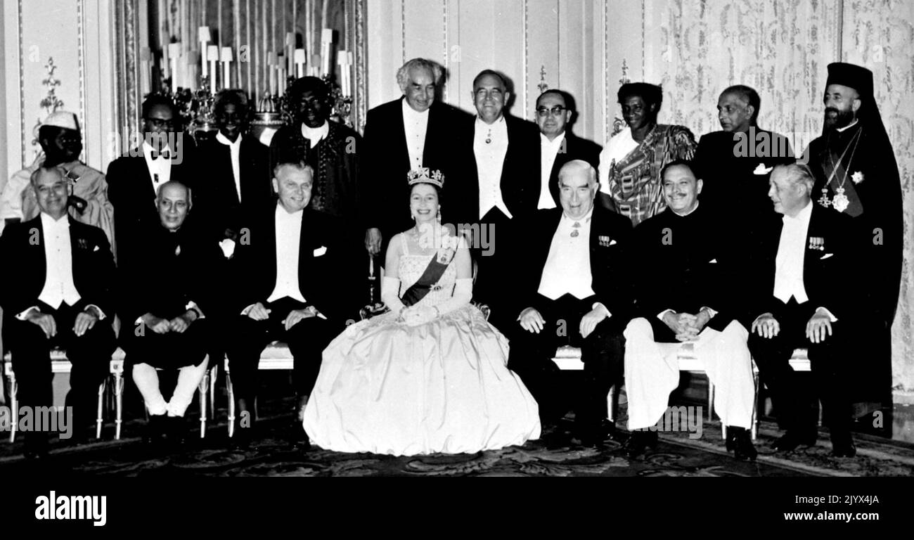 File photo dated 14/09/1962 of Queen Elizabeth II with her guests when she entertained the Commonwealth Prime Ministers to dinner at Buckingham Palace. (Back row left to right) Mr Rashidi Kawawa (Tanganyika), Dr Eric Williams (Trinidad & Tobago), Sir Milton Margai (Sierra Leone), Sir Abubakar Tarawa Balewa (Nigeria), Sir Alexander Bustamente (Jamaica), Sir Roy Welensky (Rhodesia), Tun Abdul Razak (Malaya), Mr F D K Goka (Ghana), Mr Sam P C Ferando (Ceylon), Archbishop Makarios (Cyprus). (front row, left to right) Mr Keith Holyoake (New Zealand), Pandit Jawaharlal Nehru (India), Mr John Diefenb Stock Photo