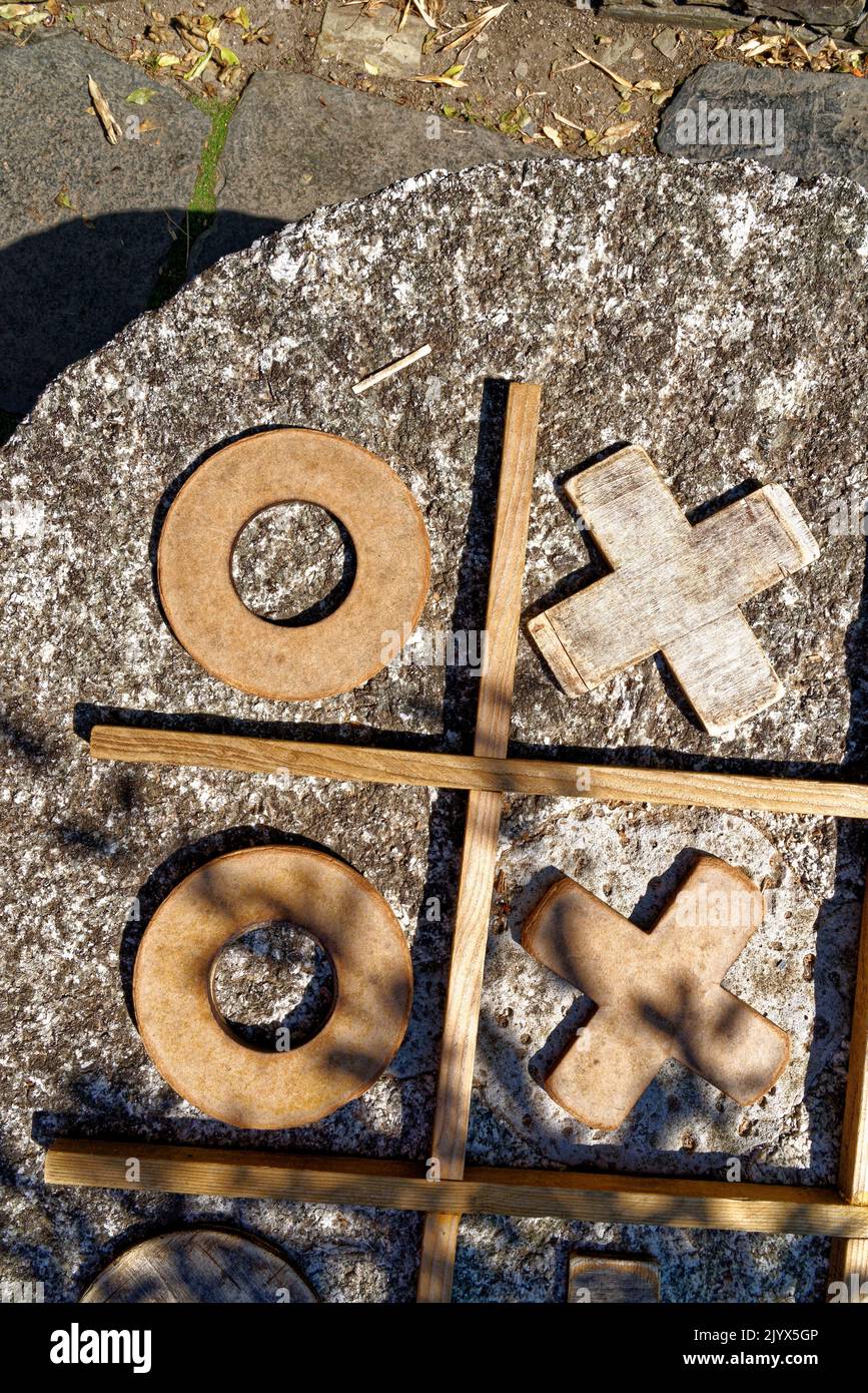 Wooden game Tic Tac Toe, close-up - Textured wooden tic-tac-toe game Stock Photo
