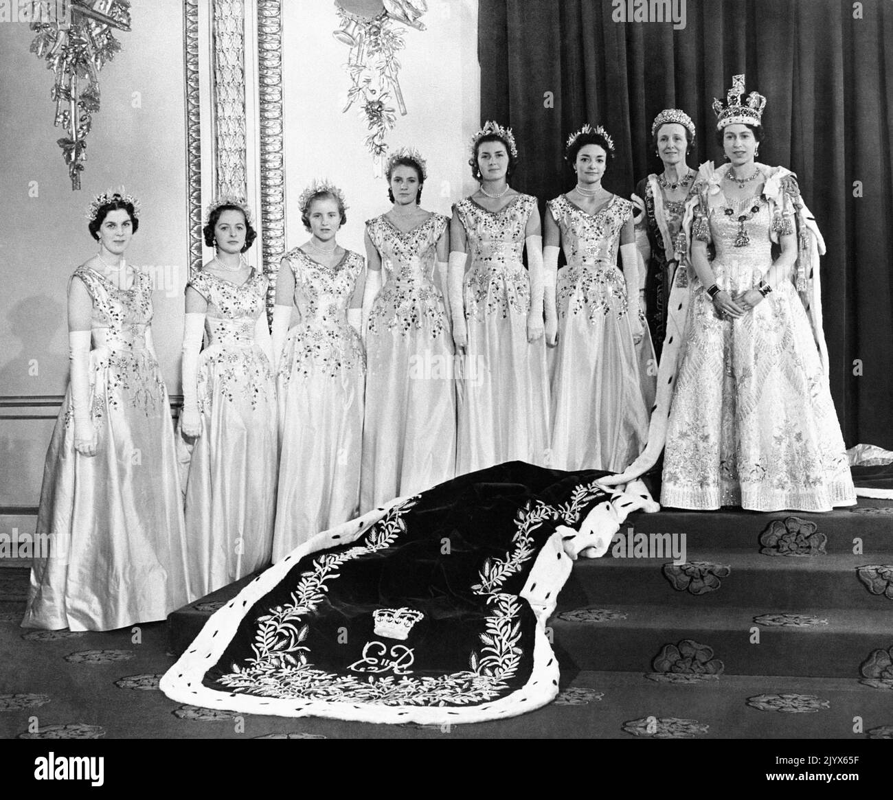 File photo dated 02/06/1953 of Queen Elizabeth II at Buckingham Palace with her maids of honour after her coronation in Westminster Abbey. The Queen died peacefully at Balmoral this afternoon, Buckingham Palace has announced. Issue date: Thursday September 8, 2022. Stock Photo