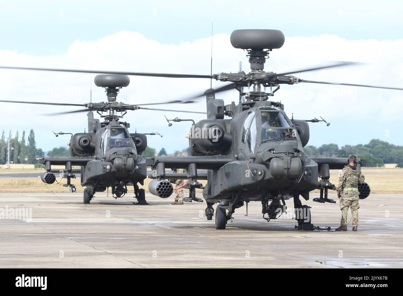 Army Air Corps Apache AH1 attack helicopters taxiing to park at Wattisham airfield. Stock Photo