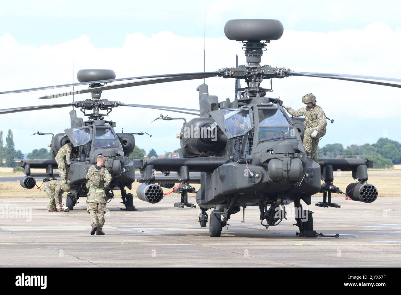 Army Air Corps Apache AH1 attack helicopters taxiing to park at Wattisham airfield. Stock Photo