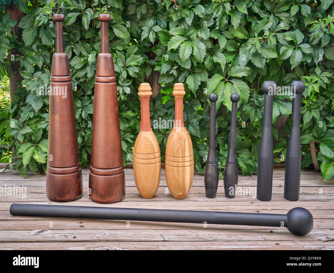 Persian meels, steel mace, Indian clubs and steel clubs on a backyard