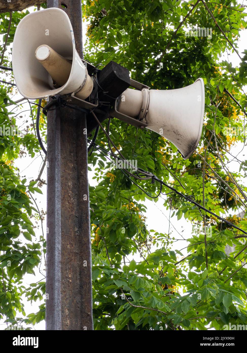The old megaphone is hanging on the sleeper pole near the platform for