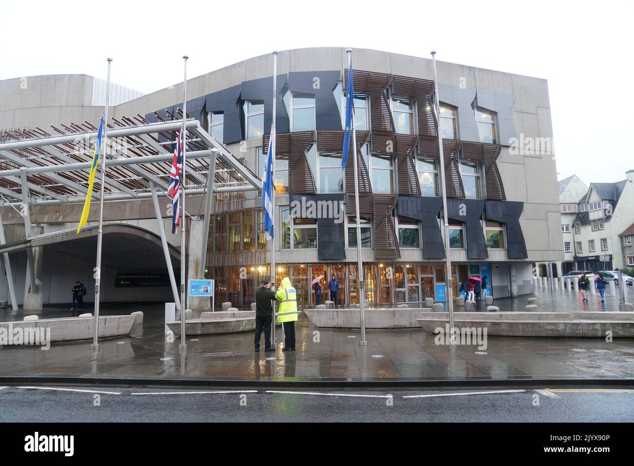 Flags being lowered to half mast outside The Scottish Parliament