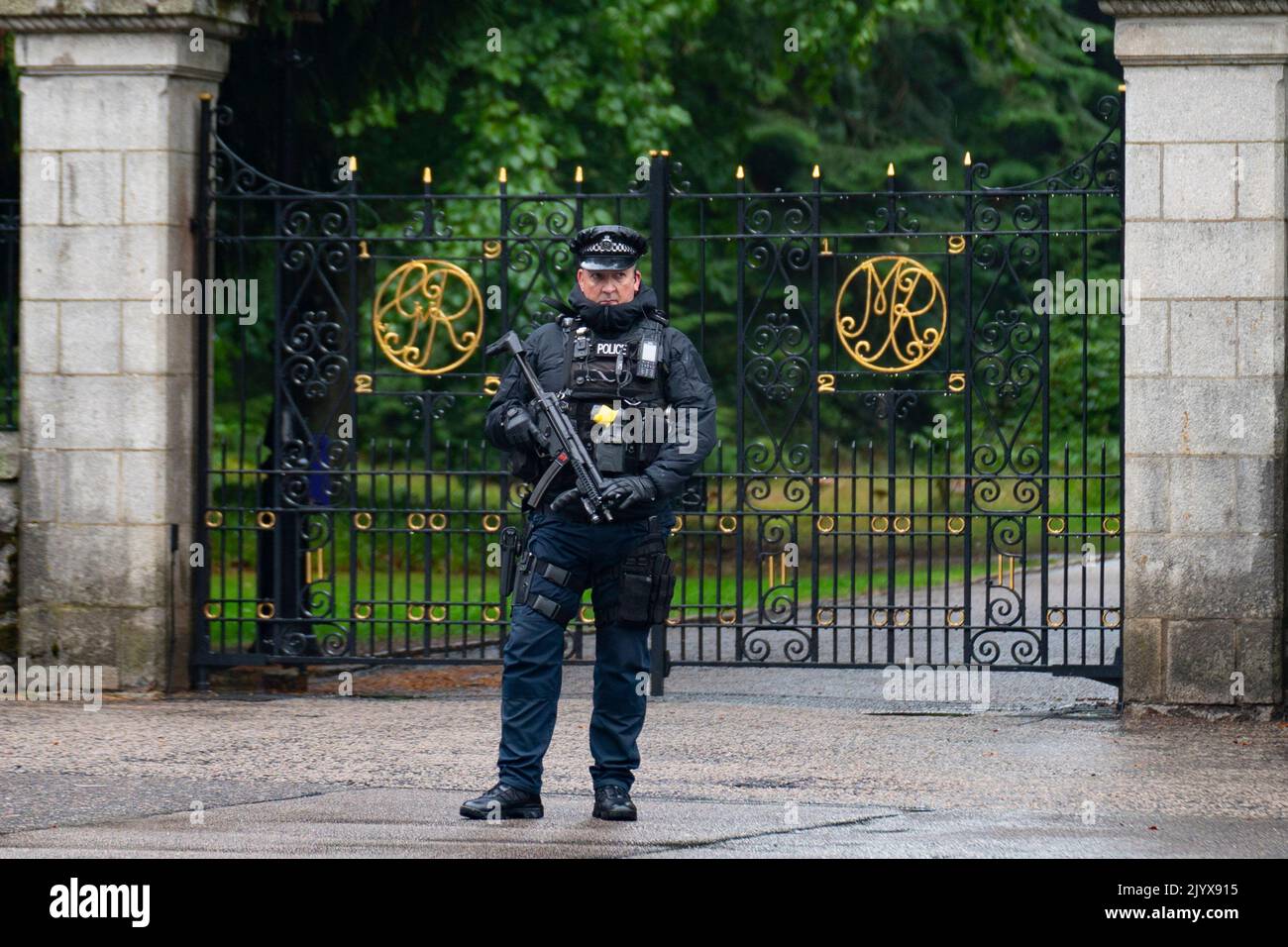 Balmoral, Scotland, UK. 8th September 2022. Armed police outside gates at Balmoral Castle following news of death of HRH Queen Elizabeth today.  Iain Masterton/Alamy Live News Stock Photo
