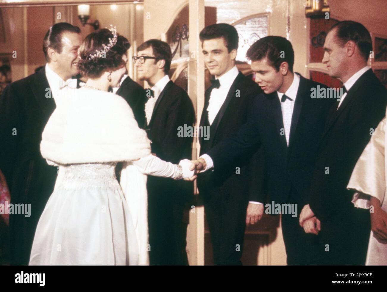 File photo dated 8/11/1964 of Queen Elizabeth II meeting Cliff Richard at the London Palladium before the Royal Variety Show. Pictured next to Cliff are 'The Shadows', including Hank Marvin (Glasses). Issue date: Thursday September 8, 2022. The monarch was not fazed by celebrities and encountered hundreds of showbiz stars, pop legends and Hollywood greats over the decades, but many admitted to nerves on coming face to face with the famous long-reigning sovereign. Stock Photo