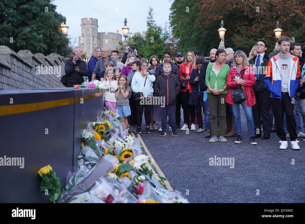 Mourners gather laying flowers outside Windsor Castle in Berkshire