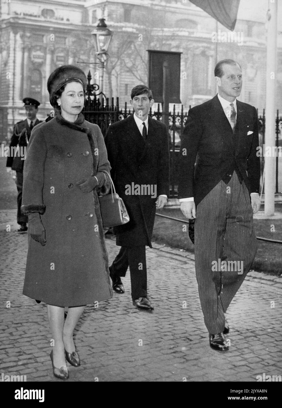 File photo dated 28/12/1965 of Queen Elizabeth II and the Duke of Edinburgh, followed by Prince Charles, as they arrive at the West Door of Westminster Abbey, London, to attend with other members of the Royal family a service marking the 900th anniversary of the consecration of the first Abbey church in 1065. Being head of state was a full-time job and left the Queen as a young mother with limited time for her children. Nannies were called upon and boarding school was considered essential for the royal youngsters. It was also regarded as a progressive choice at the time and encouraged the Quee Stock Photo
