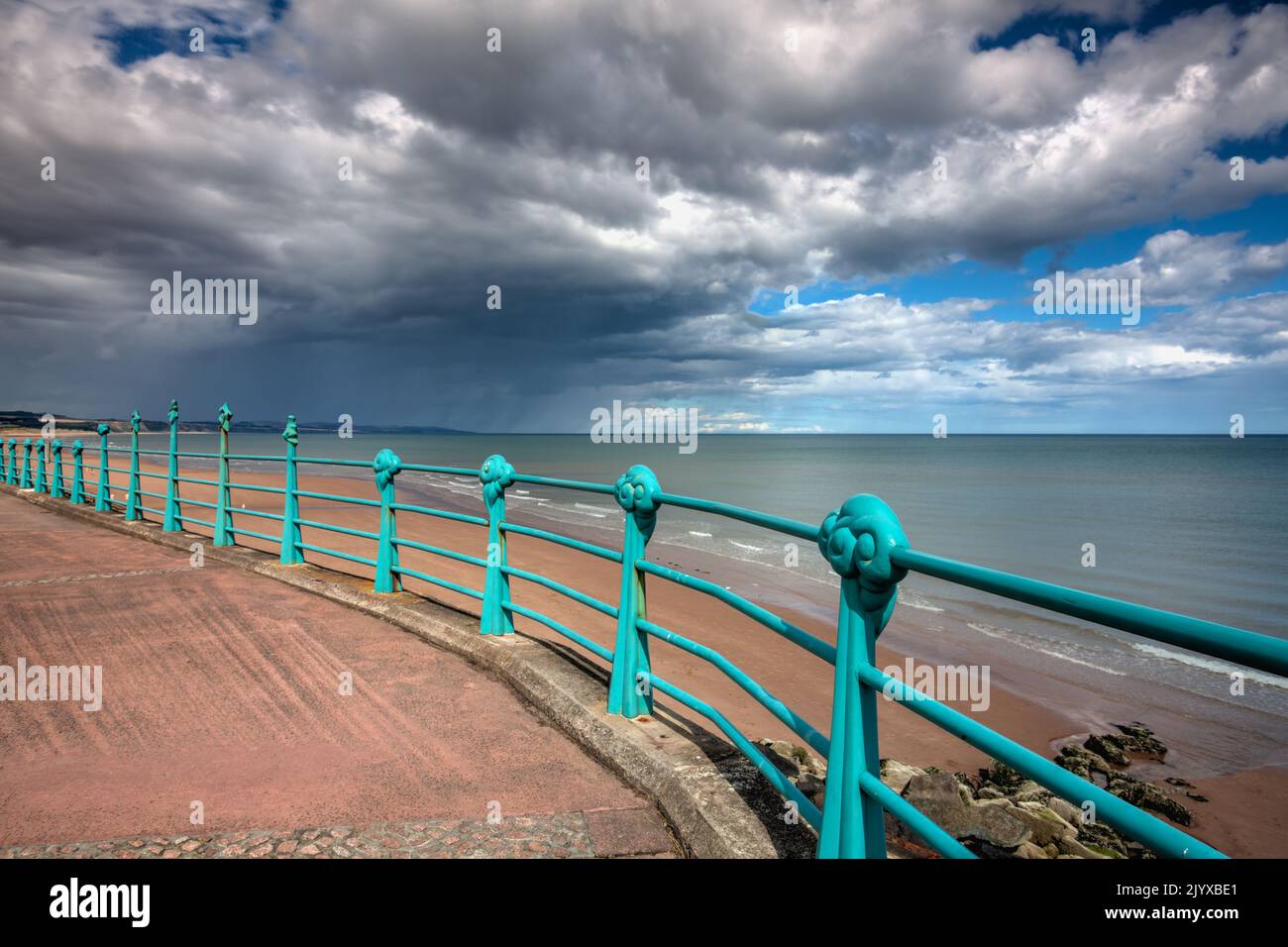 On the boardwalk in Montrose before the storm. Montrose is a town and former royal burgh in Angus, Scotland. Montrose lies between the mouths of the N Stock Photo