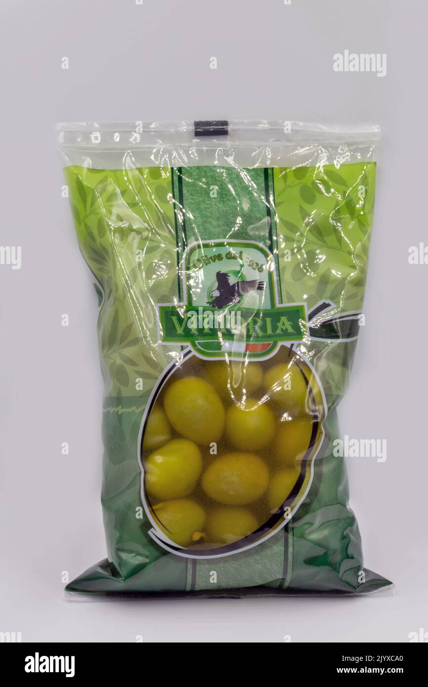 Kyiv, Ukraine - August 23, 2021: Studio shoot of big green pitted whole italian olives Vittoria package closeup on white. Stock Photo
