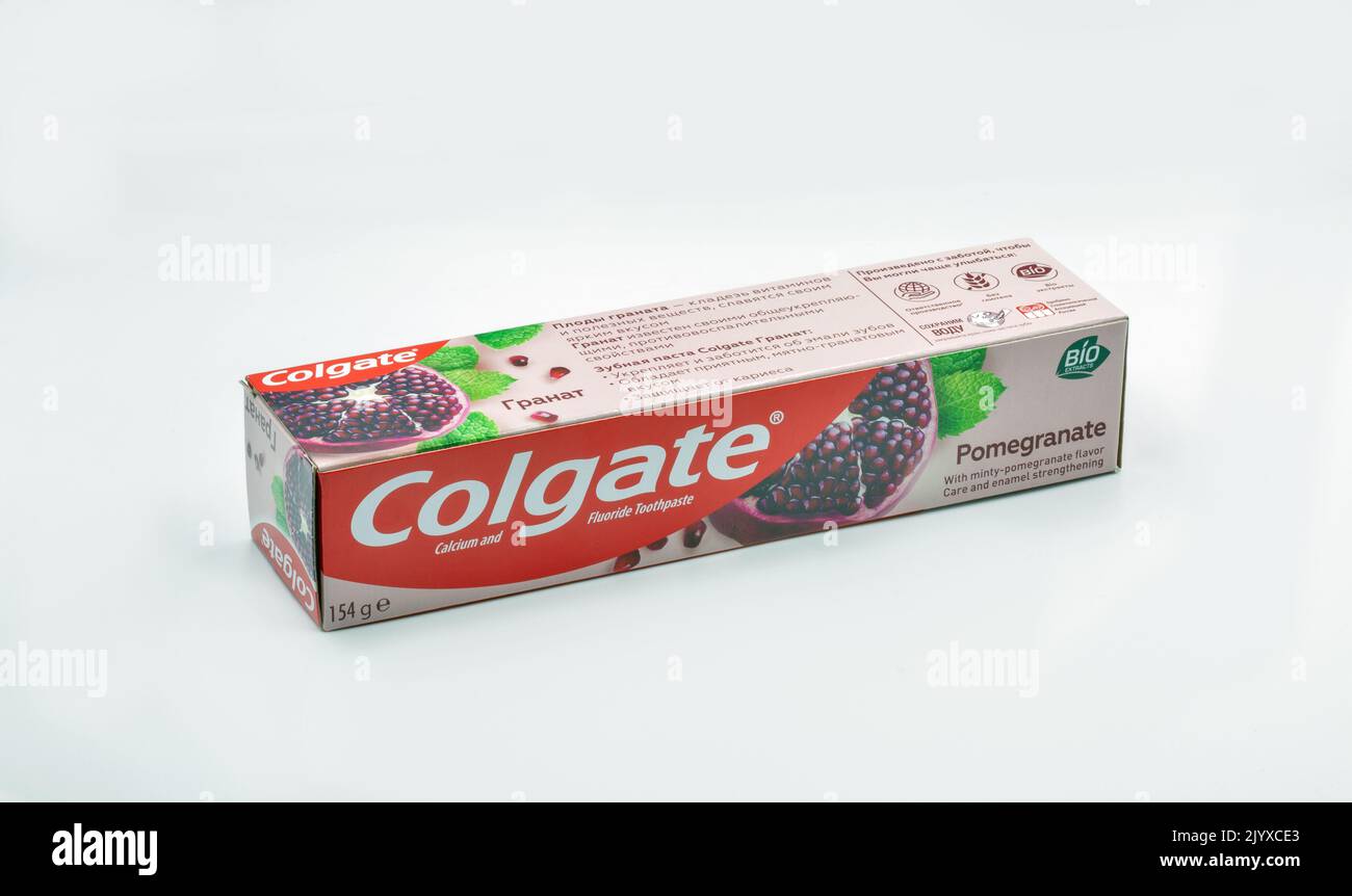 Kyiv, Ukraine - October 31, 2021: Colgate pomegranate calcium and fluoride toothpaste pack closeup on white. Colgate is a manufacturer of a wide range Stock Photo