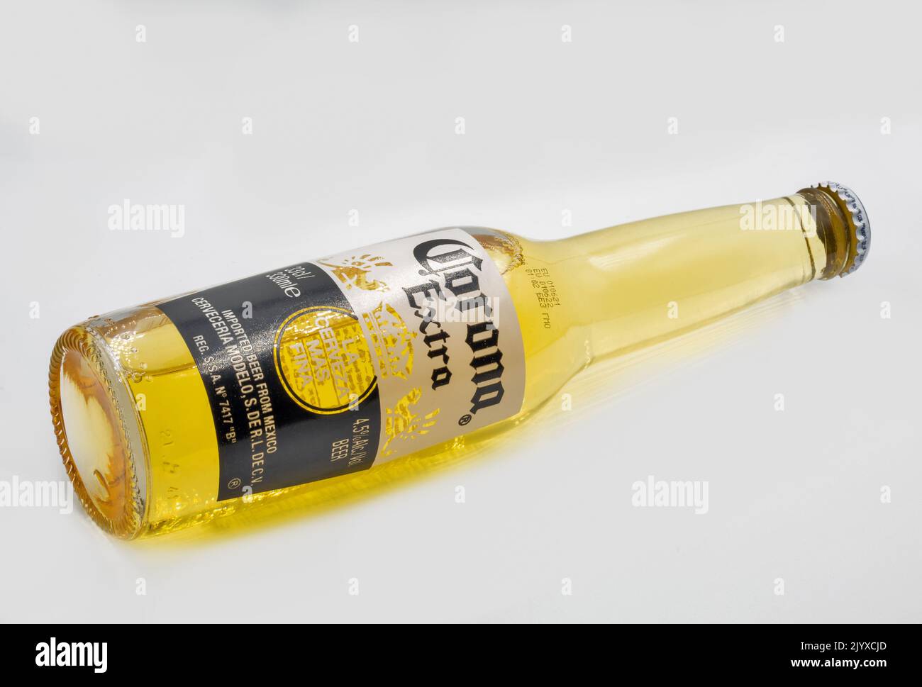 Kyiv, Ukraine - November 21, 2021: Studio shoot of Corona Extra beer bottle closeup on white. Corona Extra is produced in Mexico and exported to all o Stock Photo