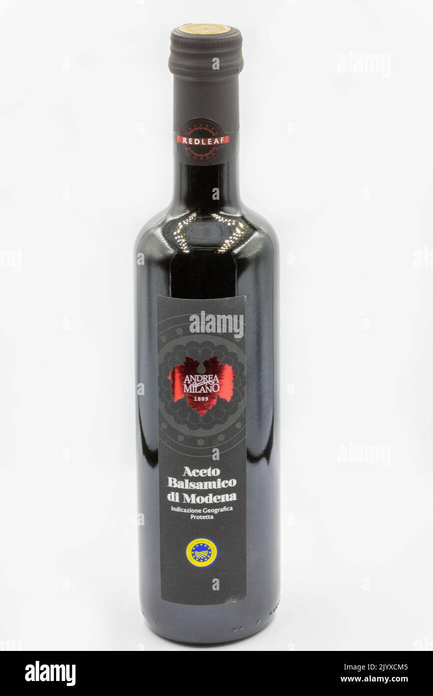 Kyiv, Ukraine - December 26, 2021: Studio shoot of Italian Balsamic grape vinegar of Modena by Andrea Milano bottle closeup on white. Stock Photo