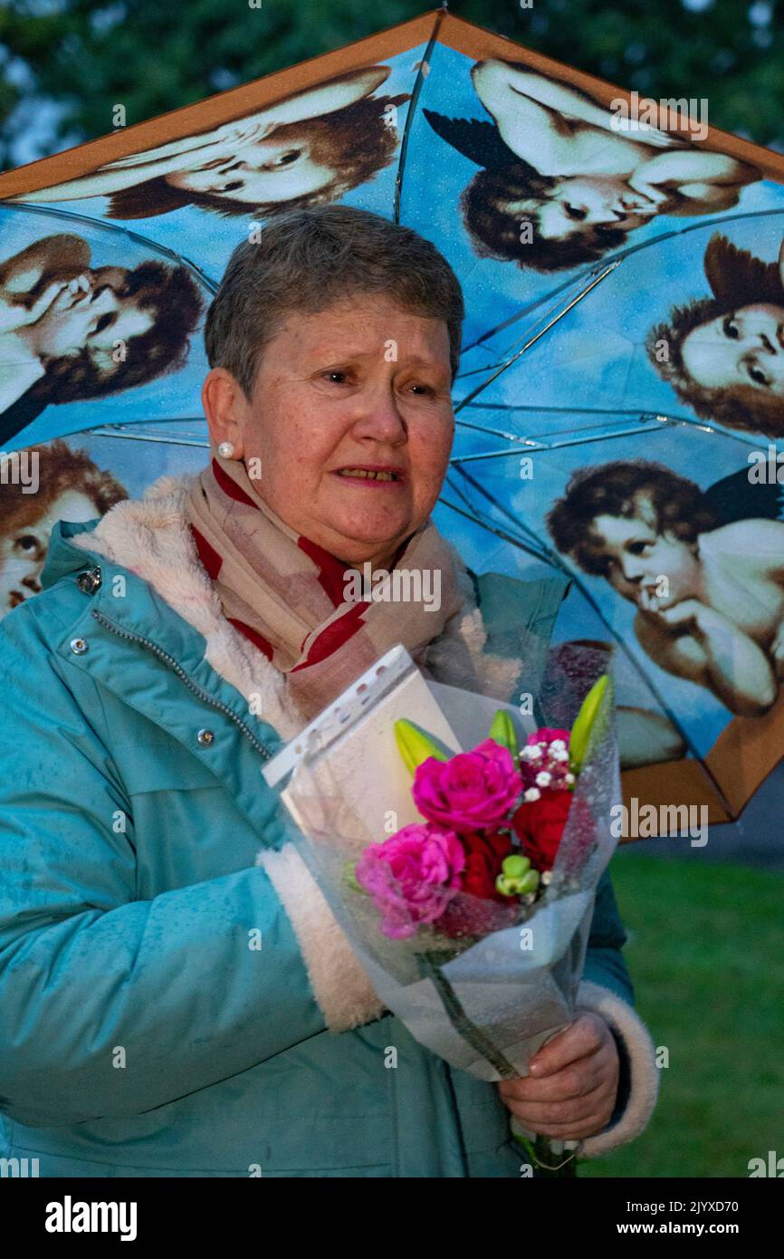 Balmoral, Scotland, UK. 8th September 2022. An emotional Elizabeth Graham from Aboyne arrives to leave flowers  at Balmoral Castle following news of death of HRH Queen Elizabeth today.  Iain Masterton/Alamy Live News Stock Photo