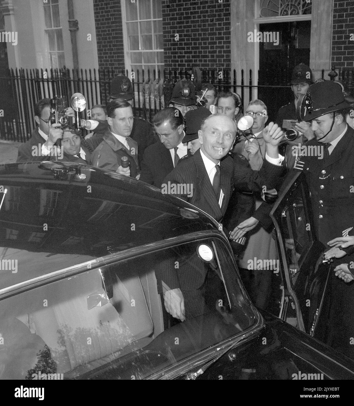 File photo dated 19/10/1963 of Lord Home waving to the crowd as Press photographers surge around him when he leaves No 10 Downing Street, London, for Buckingham Palace where he was received by the Queen in audience and he 'kissed hands' on his appointment as Prime Minister following Harold Macmillan's resignation as Prime Minister due to illness. The Queen's reign spanned many British governments under 14 prime ministers and dozens more in the Commonwealth. She received weekly briefings from the prime minister of the day and dozens of government documents passed across her desk every week for  Stock Photo