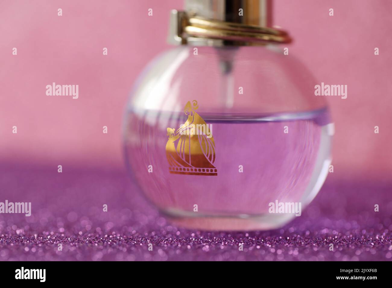 TERNOPIL, UKRAINE - SEPTEMBER 2, 2022 Lanvin Eclat Darpege perfume bottle on shiny glitter background in pink and purple colors Stock Photo