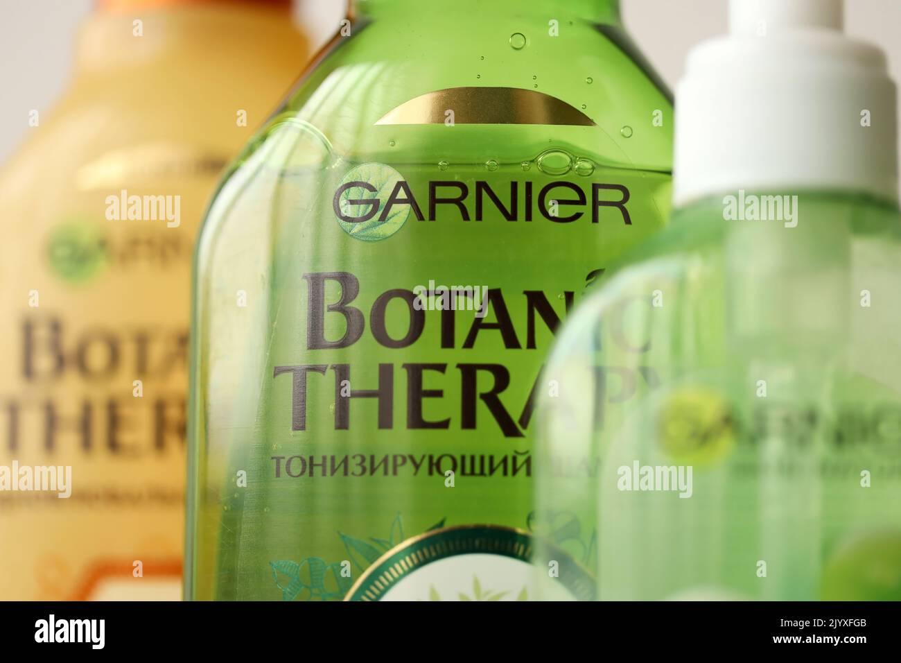 TERNOPIL, UKRAINE - SEPTEMBER 2, 2022 Bottle of Garnier Botanic Therapy Green Tea Shampoo among another Garnier company products close up Stock Photo
