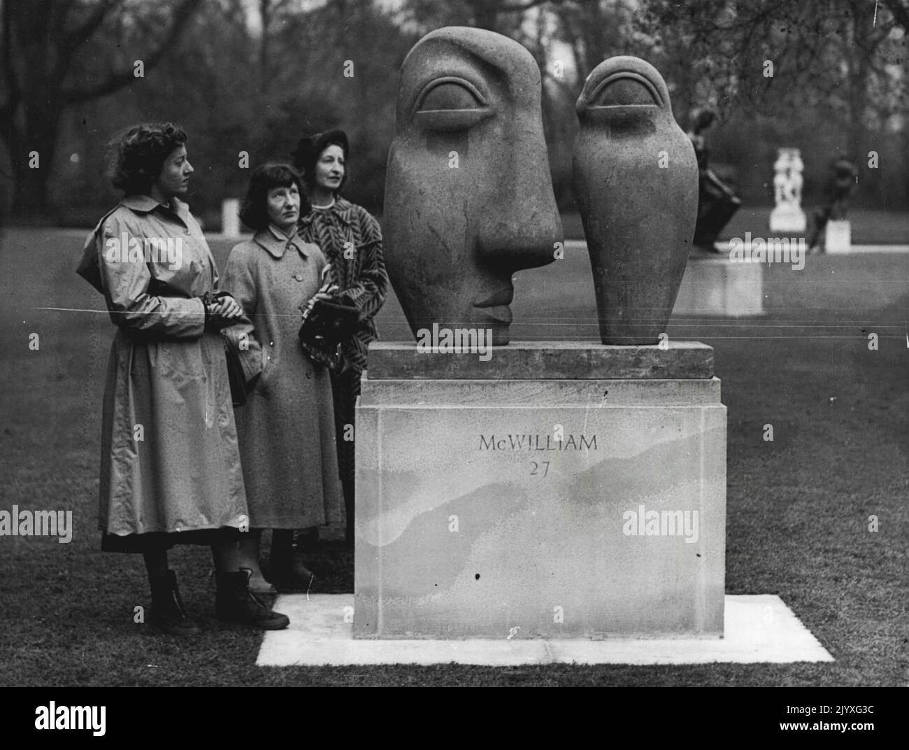 Festival Outdoor Sculpture exhibition - Battersea Park. 'I've got such a splitting headache.' (Official title: Heads in Green and Brown.). August 25, 1955. (Photo by Daily Mail Contract Picture). Stock Photo