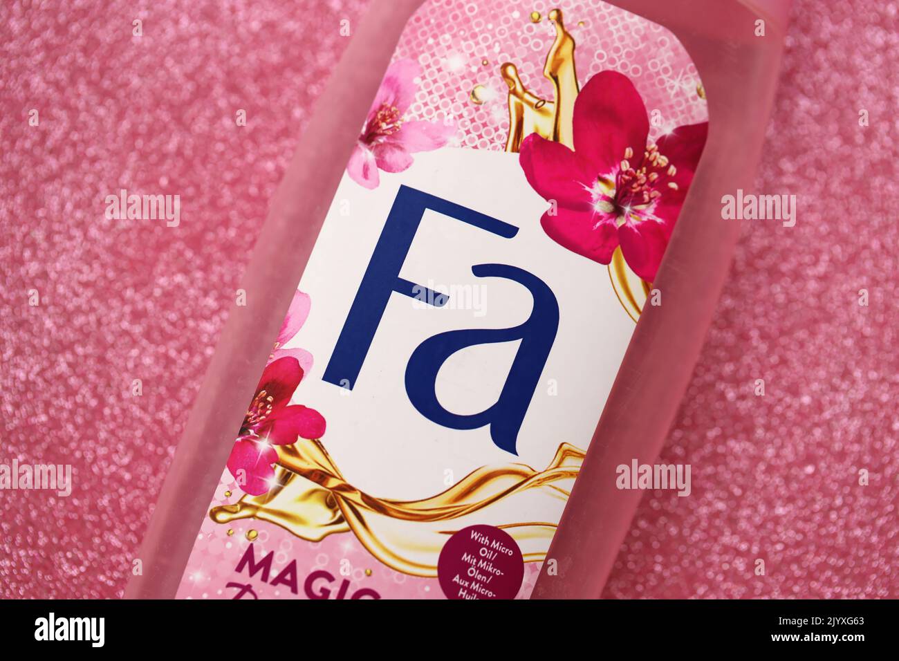 TERNOPIL, UKRAINE - SEPTEMBER 2, 2022 Bottle of Fa Magic Oil Pink Jasmine shampoo on glitter pink background Stock Photo