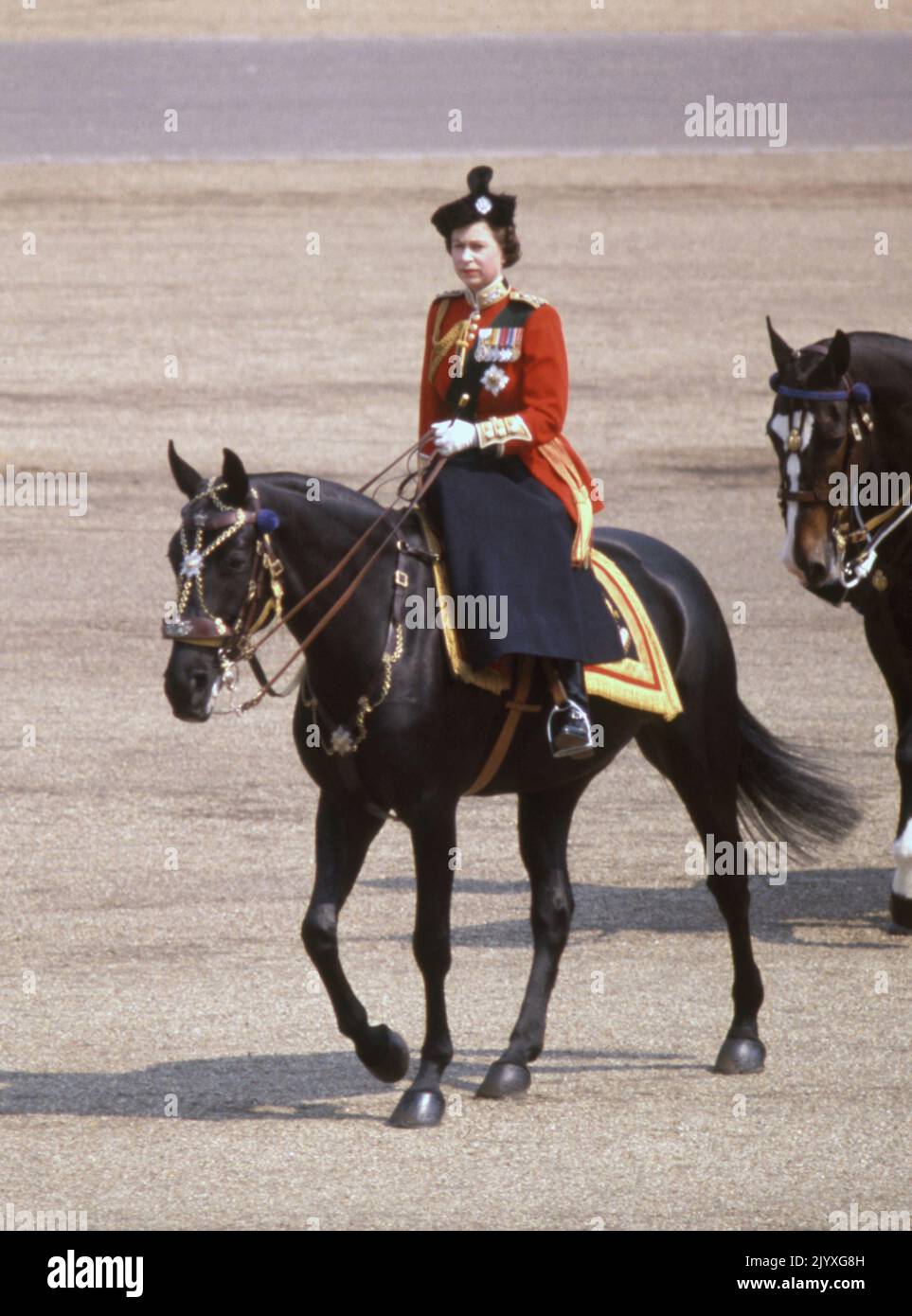 File photo dated 16/6/1969 of Queen Elizabeth II riding her horse Burmese to inspect the 1st Battalion, Scots Guards, during the Trooping the Colour ceremony at Horse Guards Parade to mark the official birthday of The Queen. Horses, like dogs, were the Queen's lifelong love and she had an incredible knowledge of breeding and bloodlines. Whether it was racing thoroughbreds or ponies, she showed an unfailing interest. Issue date: Thursday September 8, 2022. Stock Photo