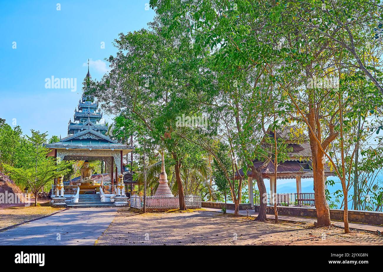 The lush green park and beautiful shrine of Wat Phrathat Doi Kong Mu Temple, Mae Hong Son, Thailand Stock Photo