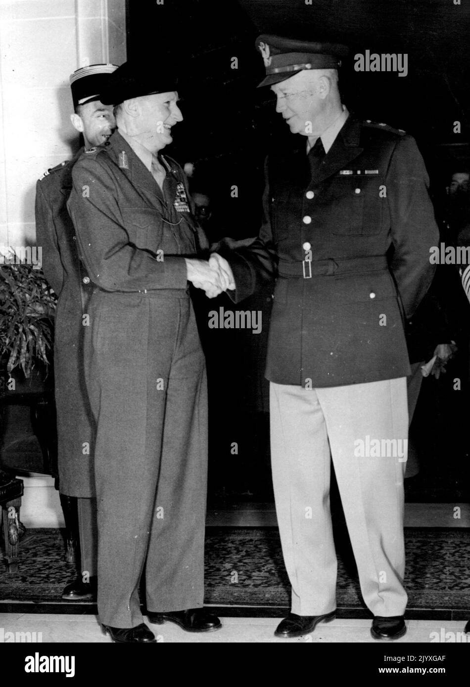 Eisenhower And Monty Meet In Paris - General Eisenhower (right) shaking hands with Field-Marshal Viscount Montgomery after the arrival of the Supreme Commander of the North Atlantic Treaty forces here. Their meeting took place at the Hotel Raphael. Figure partly hidden is that of Lt. Col. Costa de Beauregarde, the Field Marshal's aide. General Eisenhower is making a tour of the United Pact nations whose armies he will command. January 08, 1951. Stock Photo