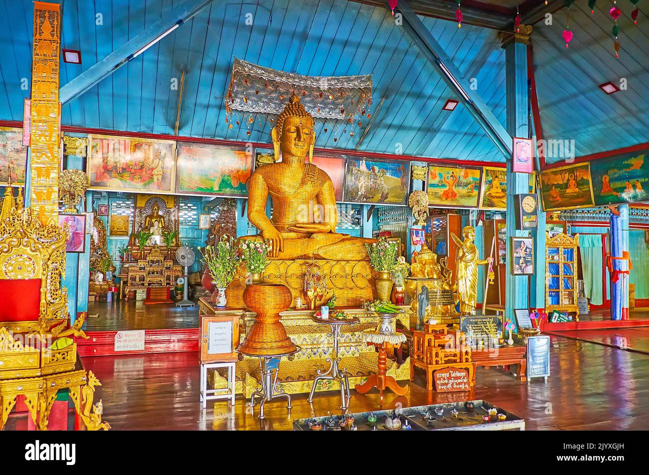 MAE HONG SON, THAILAND - MAY 6, 2019: The altar of the Main Viharn of Wat Chong Klang Temple with wicker image of Buddha in Earth Touching gesture, on Stock Photo