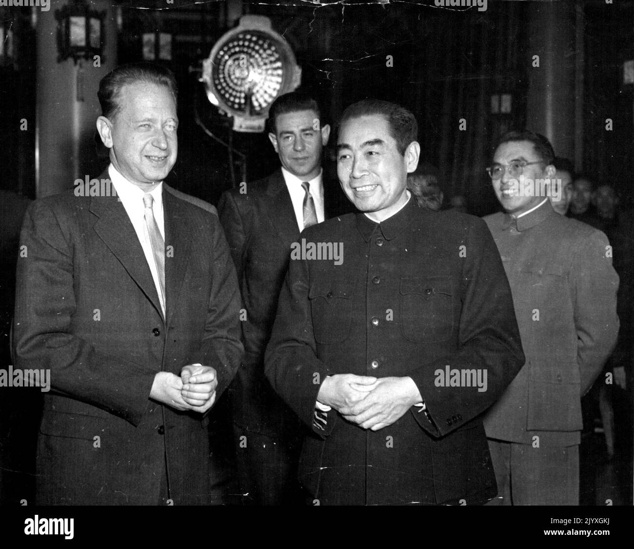 U.N. Secretary-General Meets Prime Minister Cho En-Lai - Secretary-General Dag Hammarskjold (left) of the United Nations who is now in Peking, is photographed here with Prime Minister Cho En-Lai of the Chinese People's Republic. Seen behind them are Mr. William Ranailo, an aide to Mr. Hammarskjold, and Chinese officials Mr. Hammarskjold went to China to seek, at the U.N General Assembly's request, the release of all detained U.N, Command personnel who wish to be repatriated, including II U.S. airmen sentenced to imprisonment on ***** charges by the Chinese People's Republic. January 10, 1955. Stock Photo
