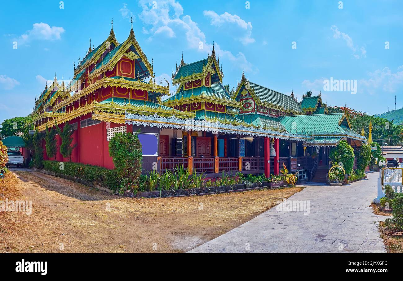 Panorama of historic wooden building of the main viharn of Wat Chong Klang Temple, surrounded with garden, Mae Hong Son, Thailand Stock Photo