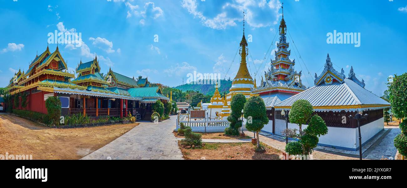 Panorama with historic wooden viharn, ornate chedi and ubosot of Wat Chong Klang Temple, Mae Hong Son, Thailand Stock Photo