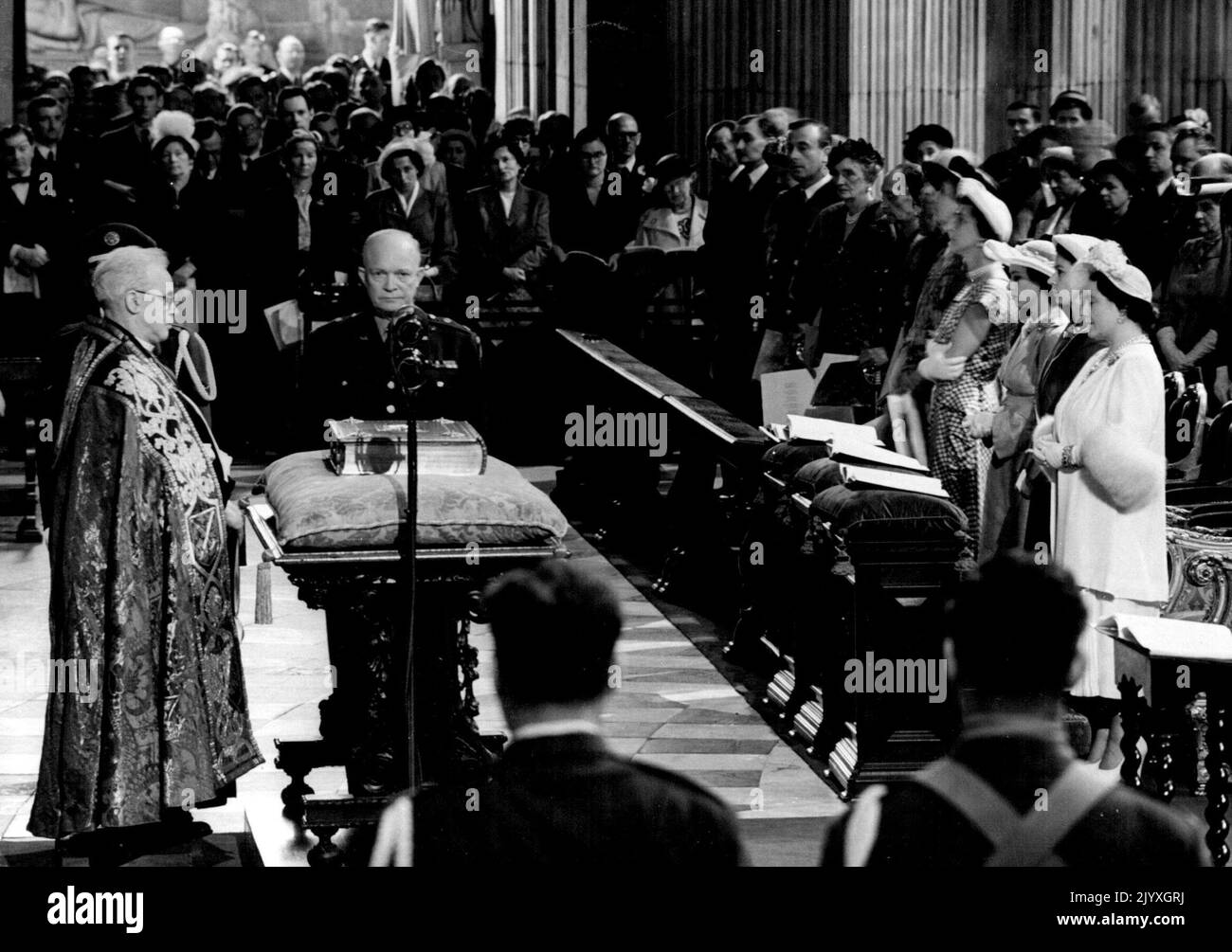 Impressive Independence Day Ceremony at St. Paul's - The impressive moment as Dr. Matthews Dean of St. Paul's dedicates the Roll of Honour facing camera is General Eisenhower and on right are Britain's Queen, Princess Elizabeth, Princess Margaret and the Duchess of Kent. Cheered by the London crowds contingents of all sections of the British and United States armed forces marched together today for the first time since the Victory Parade. They went to St. Paul's Cathedral, where members of the British Royal Family and of the British Government attended, with General and Mrs. Eisenhower, and In Stock Photo