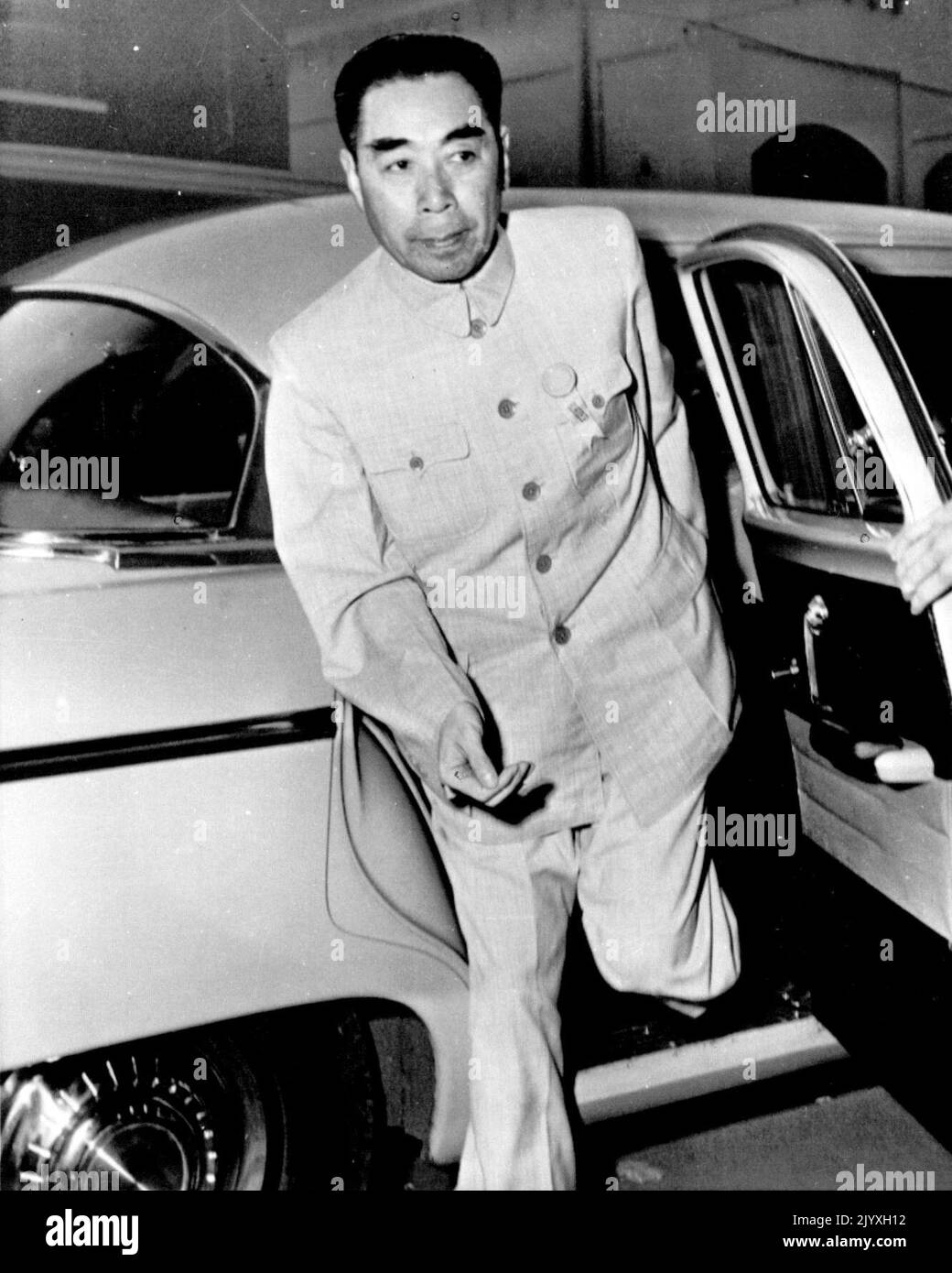 Chou Arrives For Conference -- Red China Premier Chou En-lai, who told the final session today of the 29-nation Asian-African Conference the United States and China should her together on settlement of the Formosa issue, slights from his car to attend Tuesday's meeting at Bandung, Indonesia. April 24, 1955. (Photo by AP Wirephoto). Stock Photo