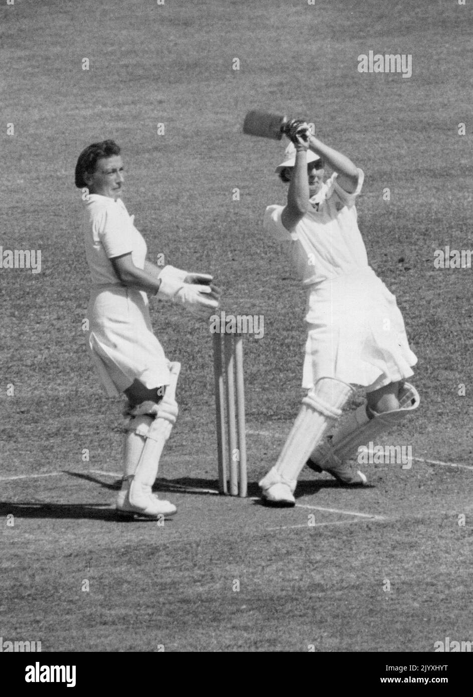 Hefty hit for four by J. Schmidt during an Australian XI's seconds innings against England in Brisbane. She made 37. December 20, 1948. Stock Photo