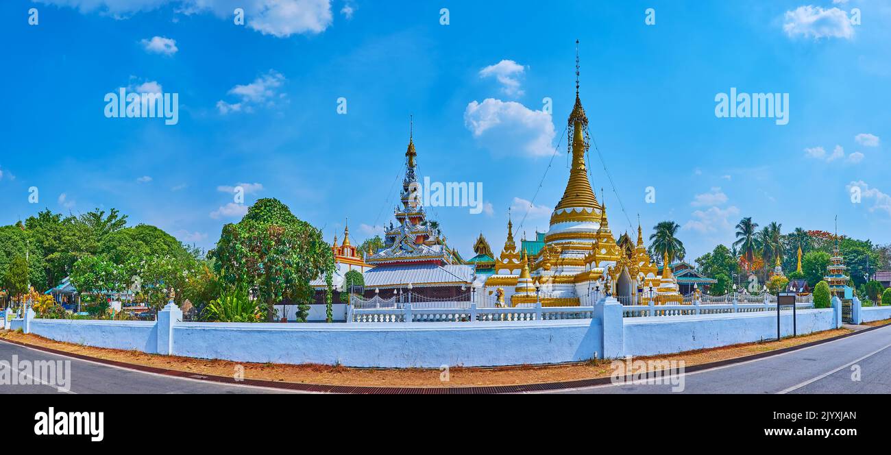 Panorama of Wat Chong Kham and Wat Chong Klang Temples of Mae Hong Son with pyathat roof of the Viharn and ornate golden Chedi, Thailand Stock Photo