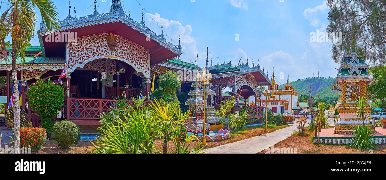 Panorama of the beautiful green garden, Viharn and interesting Burmese style shrines of Wat Chong Kham Temple in Mae Hong Son, Thailand Stock Photo