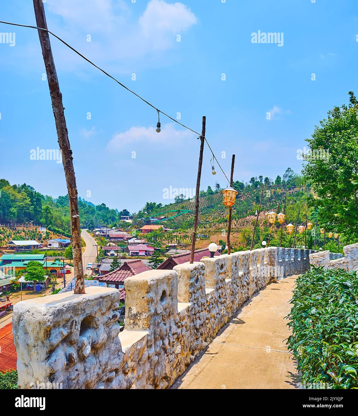 Paper Chinese lanterns decorate the stone fortress wall of Yunnan tea