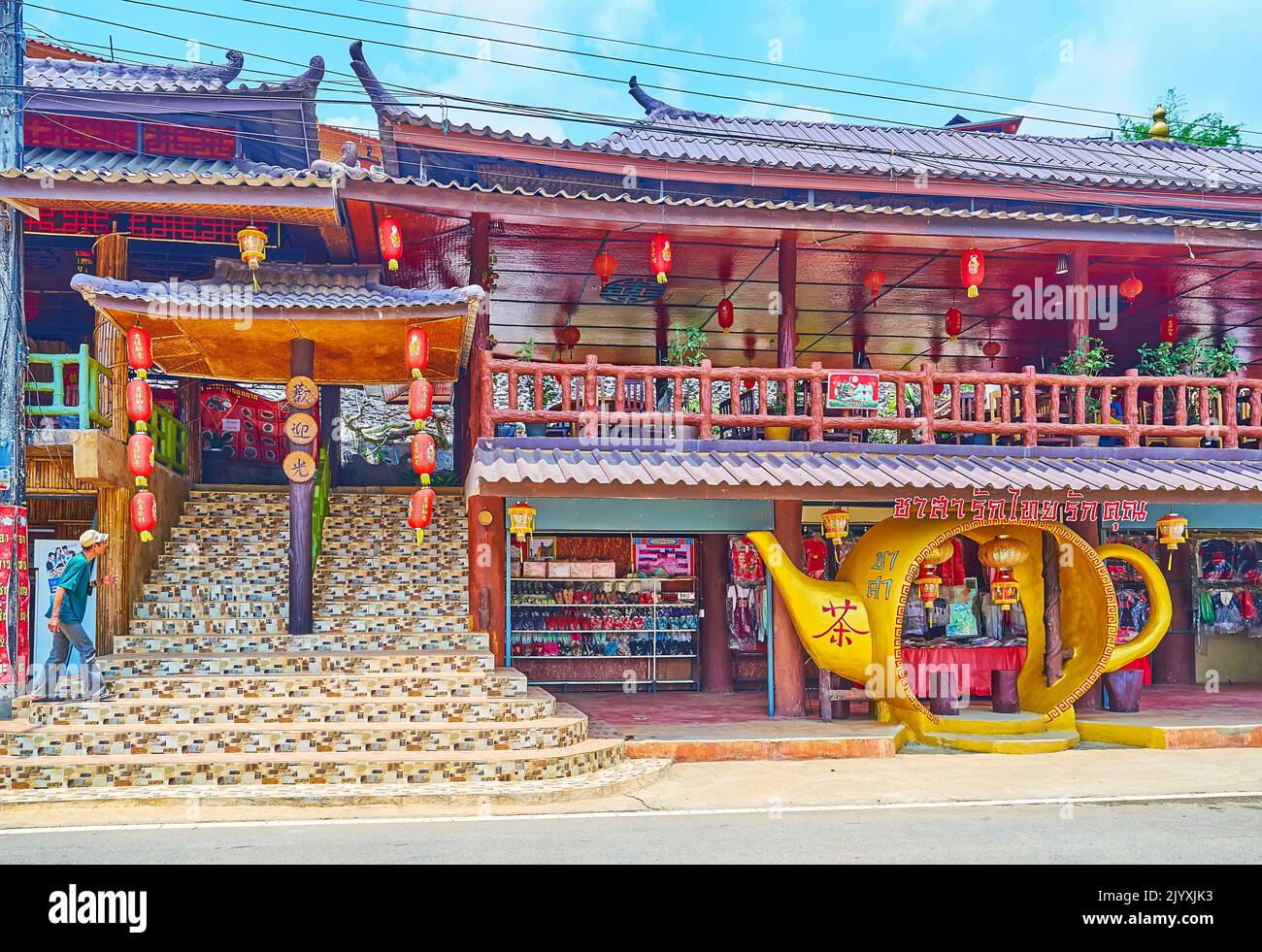 BAN RAK THAI, THAILAND - MAY 6, 2019: Chinese style pavilion of the tea market and tea house on the upper floor in Yunnan tea village, on May 6 in Ban Stock Photo