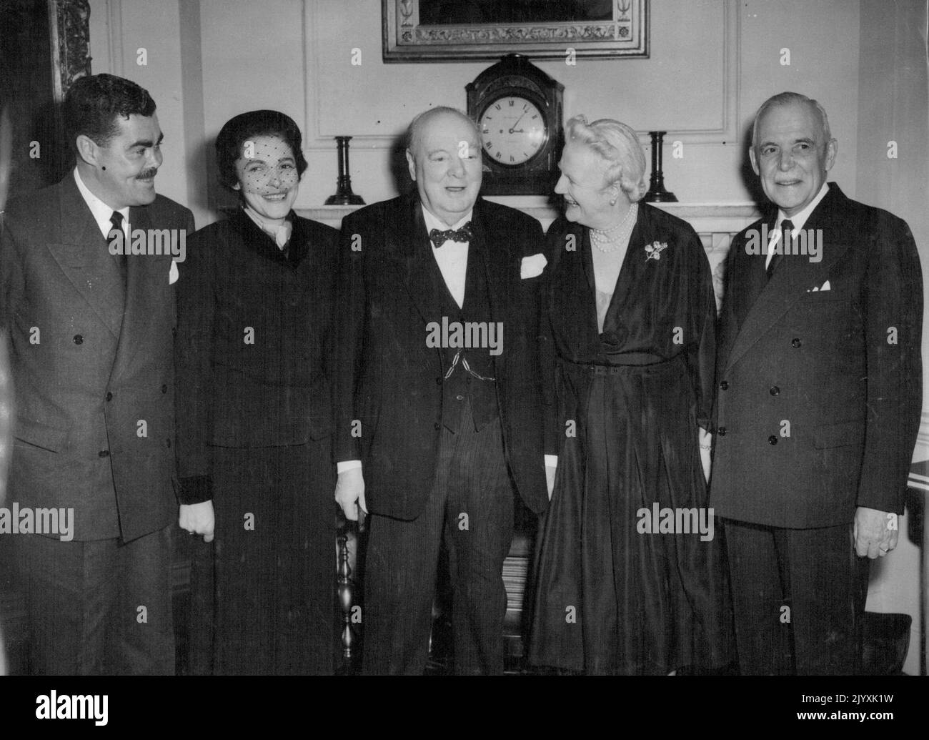 Canadian Premier Lunches With Churchill - Left to Right-Mr. Jean Paul St. Laurent: Mrs. Hugh O'Donnell (son and daughter of the Canadian Premier); Sir Winston Churchill; Lady Churchill; and Mr. Louis St. Laurent. The Canadian Prime Minister is in London on a world tour to meet leaders in the search for an approach to peace. British Prime Minister Sir Winston Churchill with his guests, Canadian Prime Minister Mr. Louis St. Laurent and members of his family, at 10, Downing Street, London, to-day (Saturday). February 06, 1954. (Photo by Reuterphoto). Stock Photo
