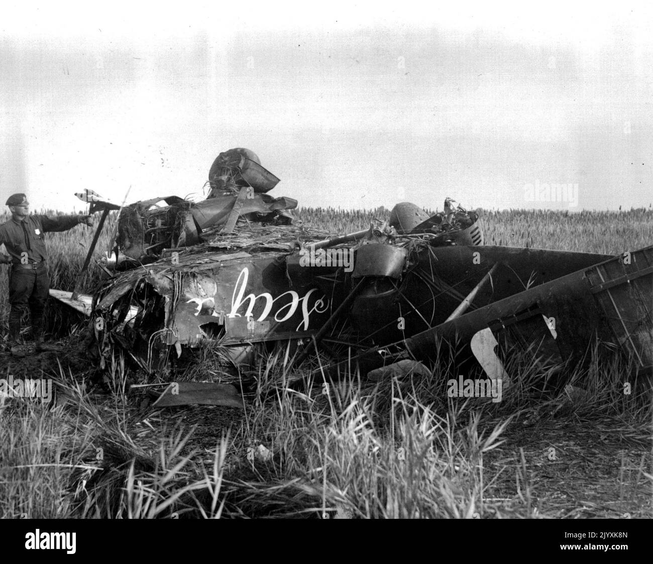 Jorney's End For The Mollisons - The plane of Capt. and Mrs. J.A. Molllison Wrecked in the swamp at the edge of the Bridgeport , Conn. Municipal Airport, the morning after the British couple crashed after making a forced landing. Their plane overshot the filed and capsized in the Mire. Capt. Mollison and his wife were both injured but neither seriously. September 11, 1933. (Photo by Associated Press Photo). Stock Photo