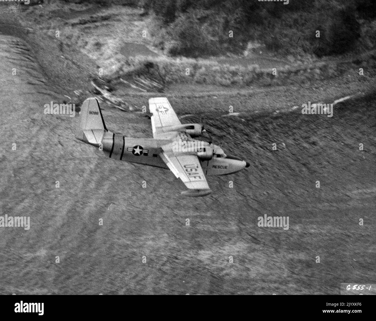 Search - An SA-16 Grumman Albatross of the 3rd Air Rescue Squadron, the search end rescue unit serving the U. S. Far East Air Forces, has one primary duty--constant patrol of the water lanes over which fighters, light and medium bombers of Far East Air Forces and its attached units fly. One is shown cruising at a medium low altitude- alert for signs of trouble. March 10, 1951. (Photo by U. S. Air Force Photo) Stock Photo