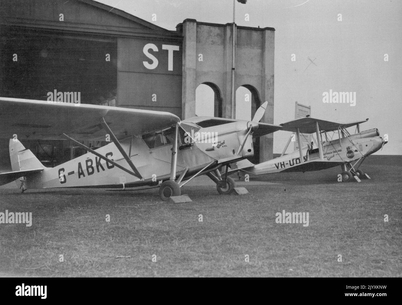 Famous British Airman Out To Break Two New World's Long-Distance Records. Mollison and Scott's machines ready to start from Lympne Aerodrome. Mr. C.W.A. Scott, and Mr. J.A. Mollison, are attempting to break two world's records. Mr. Scott to Australia and Mr. Mollison to the Cape. The Australian record is 9 days, 2 hours 29 mins., and the cape record 5 days 6 hours. The present records are held by Mr. Bulter and Miss Salaman respectively. May 4, 1932. (Photo by Central News). Stock Photo