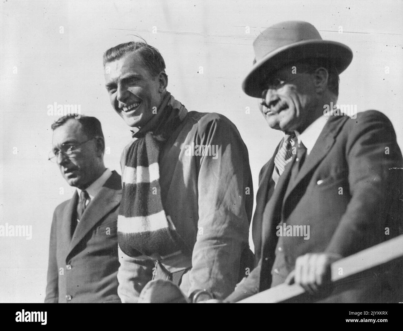 The Smile That Charmed Brisbane - From the moment Mr. Scott landed in Brisbane his thanks for the tumultuous welcome were 'smiled'. Here he is on the platform at the Archerfield aerodrome, beside the Lord ***** (Ald A Watson) who has made the first public greeting. April 15, 1931. Stock Photo