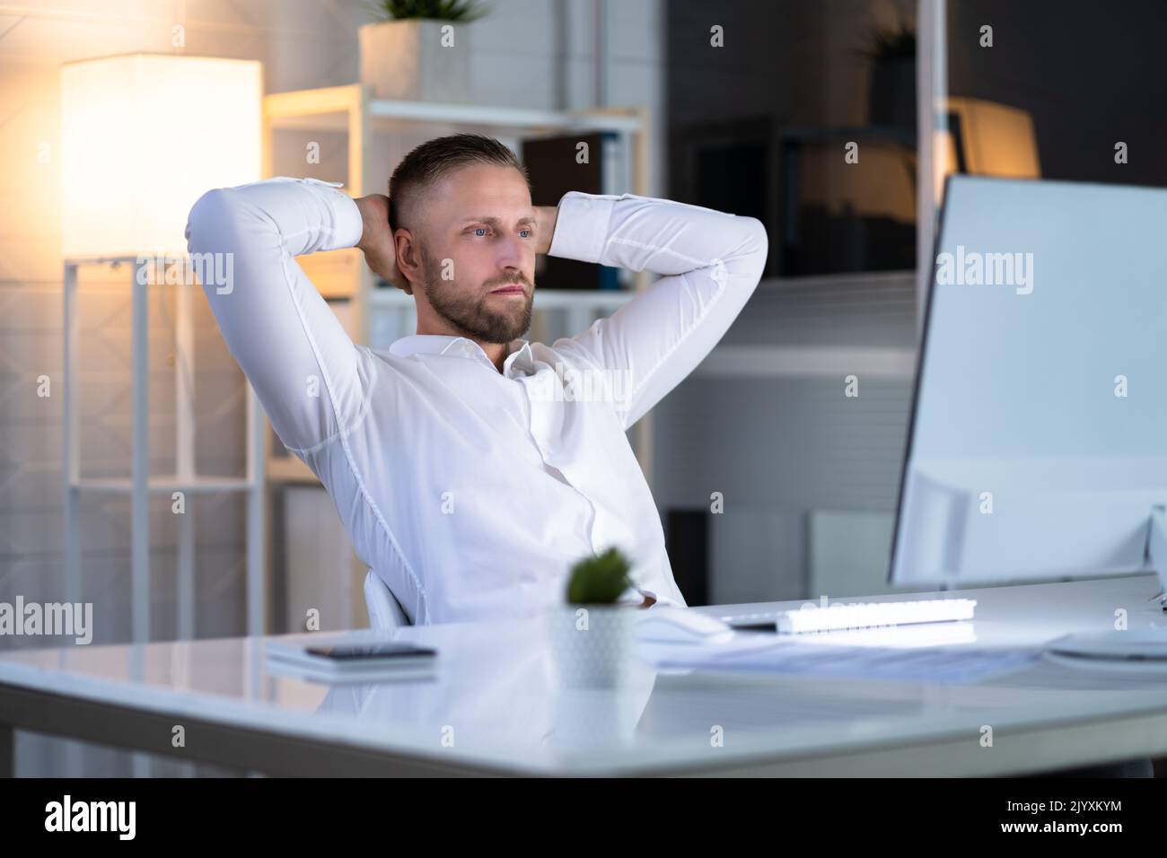 Foto de Handsome young businessman resting at workplace lean on comfort  chair closed eyes enjoy fresh conditioned air. Satisfied employee finish  work feels serene relaxing in modern office, no stress concept do