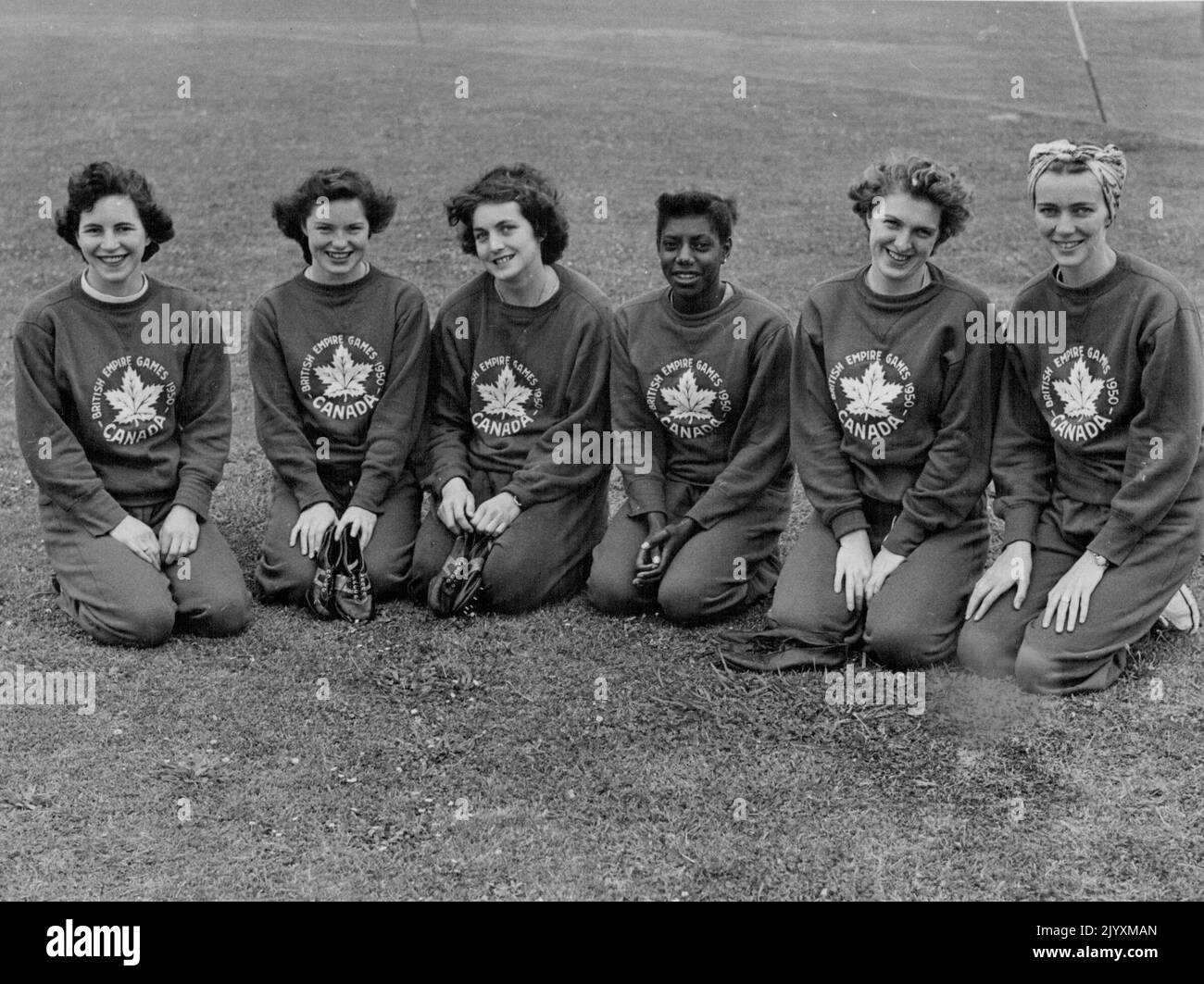 Six of the girls in their track suits. Left to Right are Elaine Silburn, Gerry Bemister, Pat Jones, Rosella Thorne, Eleanor McKenzie and Shirley Gordon. Canadian girl Athletes in track training at Auckland. The Canadians were the first team to arrive in NZ for the Empire Games, which will be held from February 4 to 11. From left the girls are Eaine Silburn, Gerry Bernister, Pat Jones, Rosella Thorne, Eleanor McKenzie and Shirley Gordon. January 19, 1950. Stock Photo
