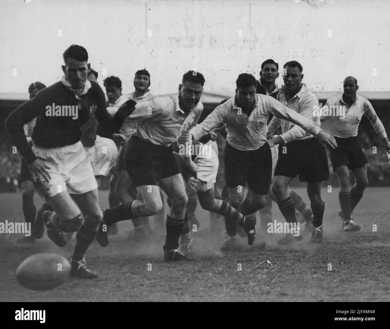 South African forwards break through from a lineout, with Australian Garth Jones falling back in defence, during the second Rugby union test at Capetown. Australia won, 18-14. Jones scored the winning try. September 19, 1953. Stock Photo