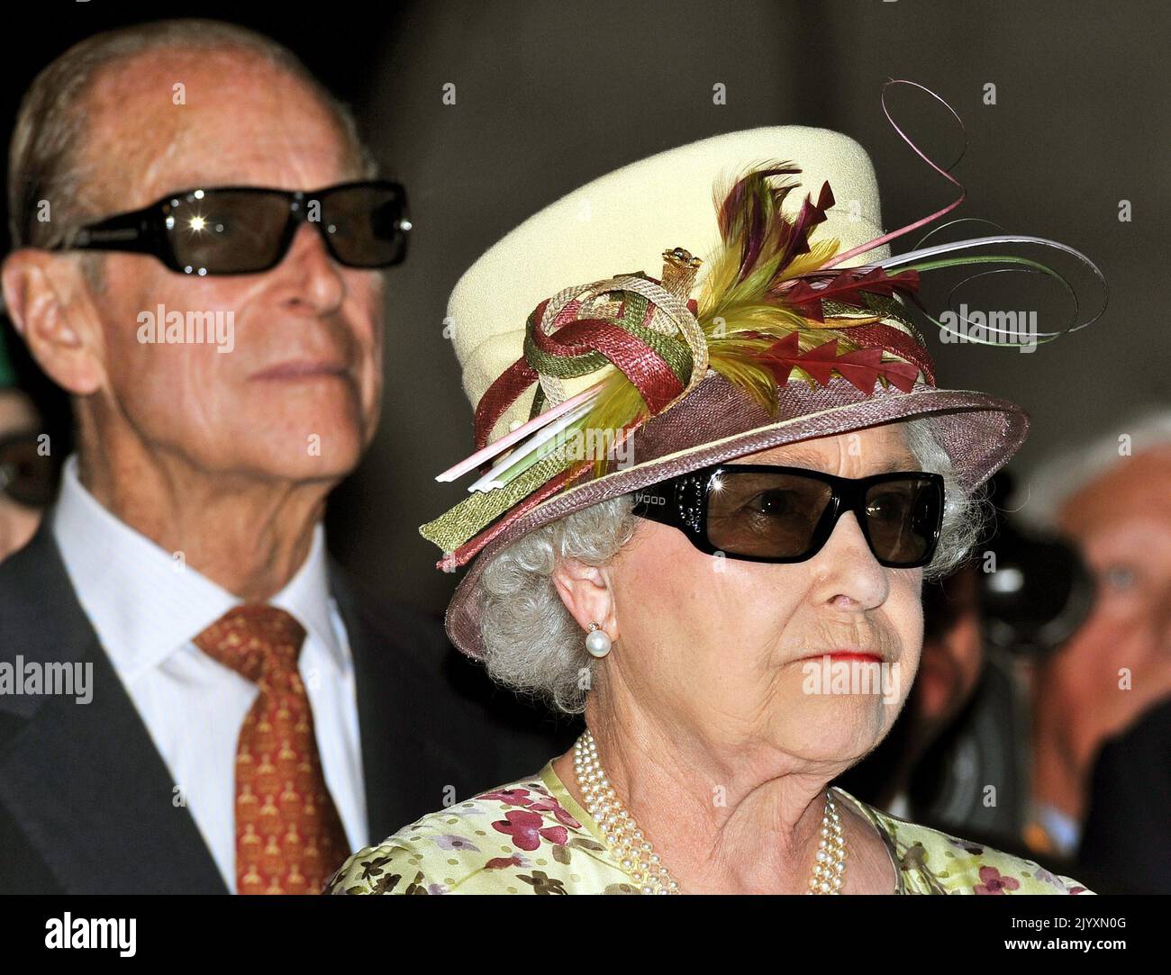 File photo dated 05/07/10 of Queen Elizabeth II and the Duke of Edinburgh wearing 3D glasses to watch a 3D film, at the Pinewood Studios in Toronto, Canada. Issue date: Thursday September 8, 2022. Stock Photo