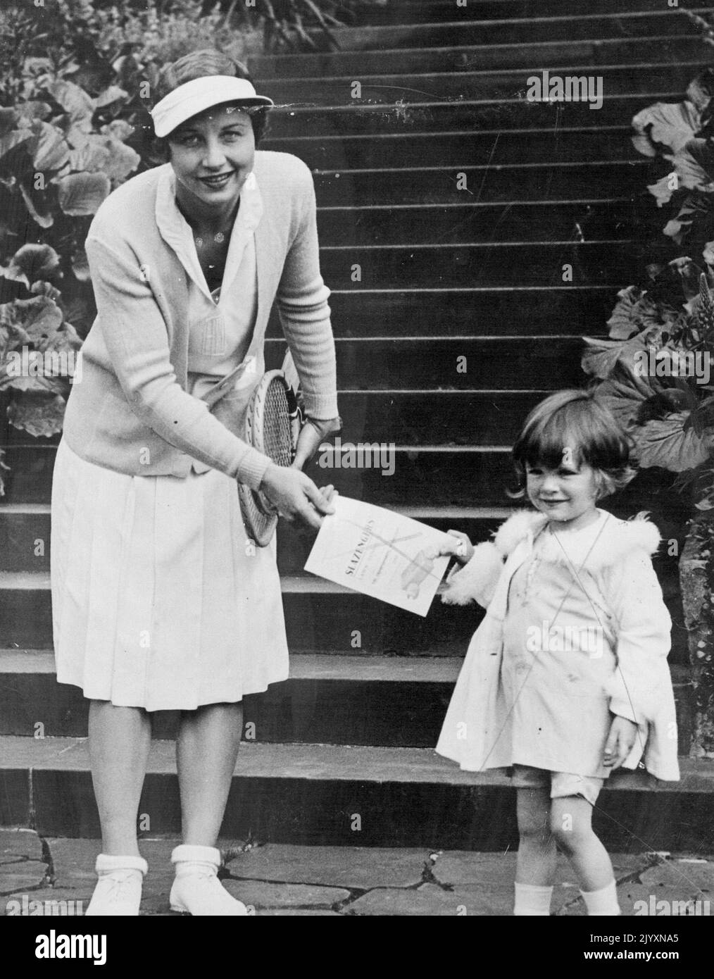 Tennis Queen -- Mrs. Helen Wills Moody buying a programme from Lady ...